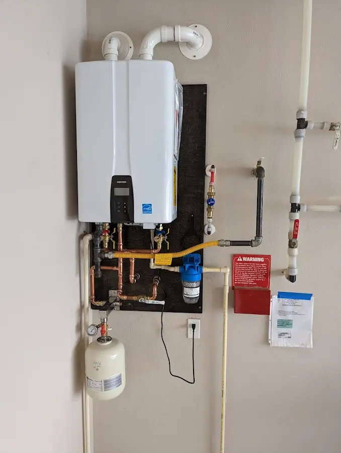 Professional plumber installing copper piping in a Dripping Springs home